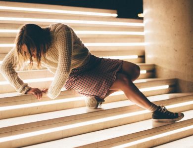 woman sitting down on stair