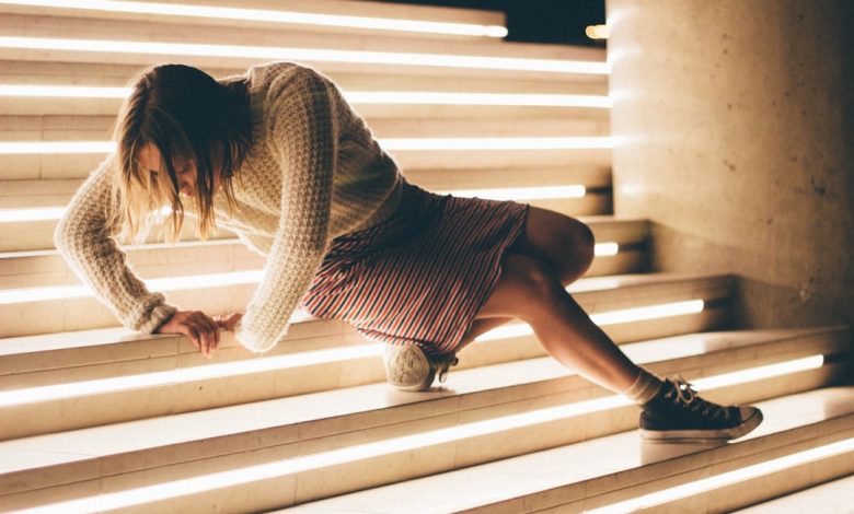 woman sitting down on stair