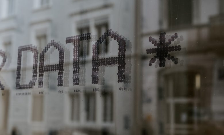 a close up of a window with a building in the background