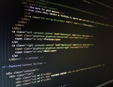 Close-up of HTML code displayed on a computer monitor, showcasing web development.