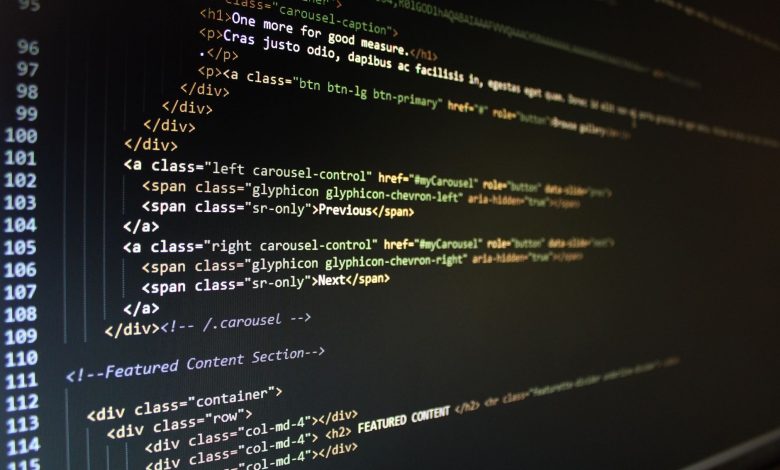 Close-up of HTML code displayed on a computer monitor, showcasing web development.