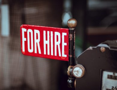 shallow focus photography of red and white for hire signage