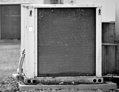 Close-up of an industrial HVAC unit outdoors, showcasing its metal texture.