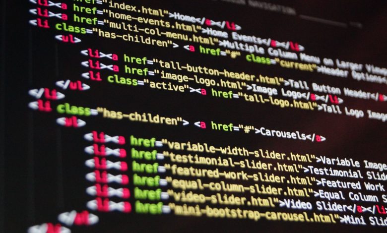 Close-up of HTML code highlighted in vibrant colors on a computer monitor.